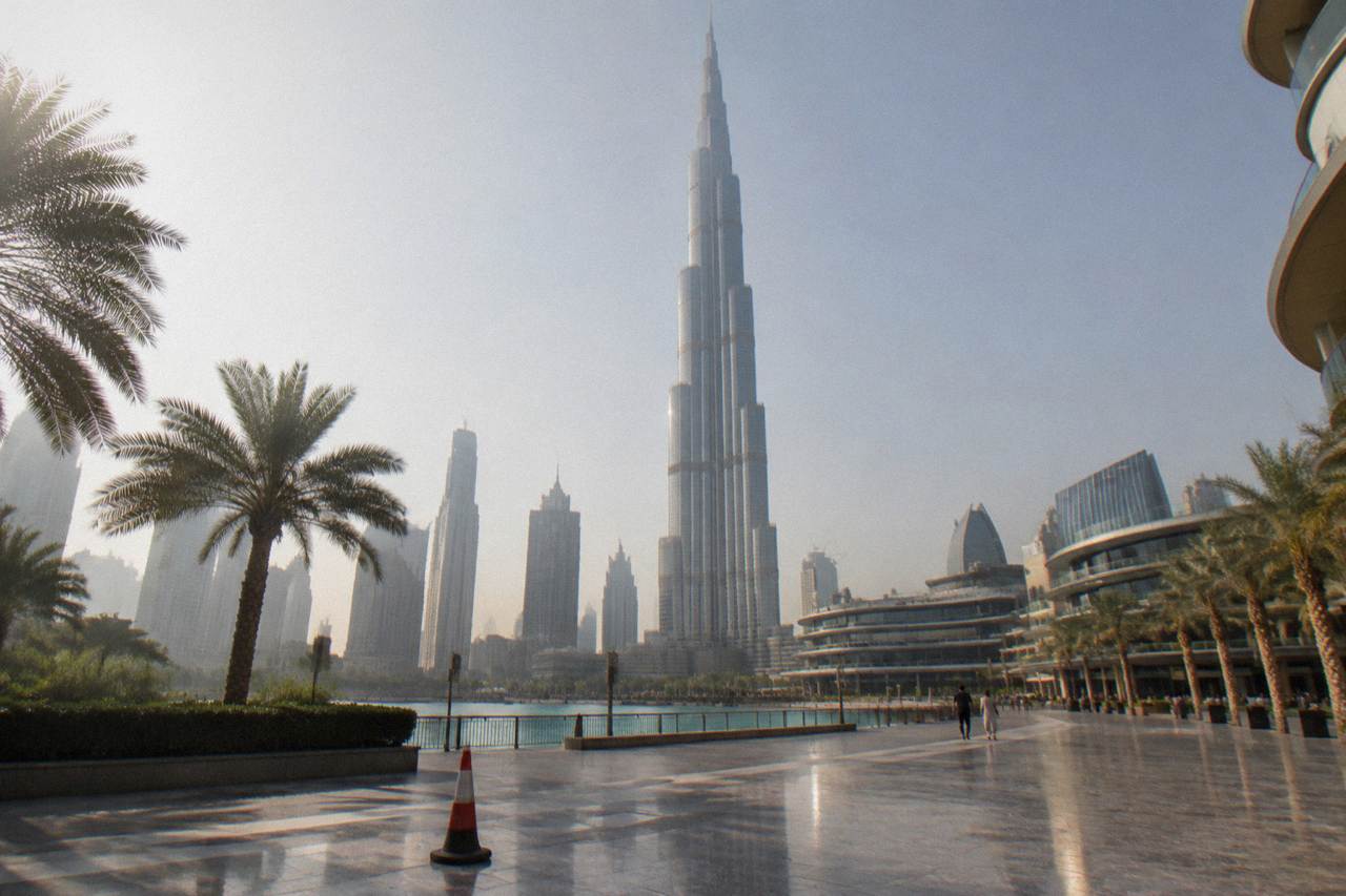 The Burj Khalifa rising above the Downtown Dubai skyline under a clear sky
