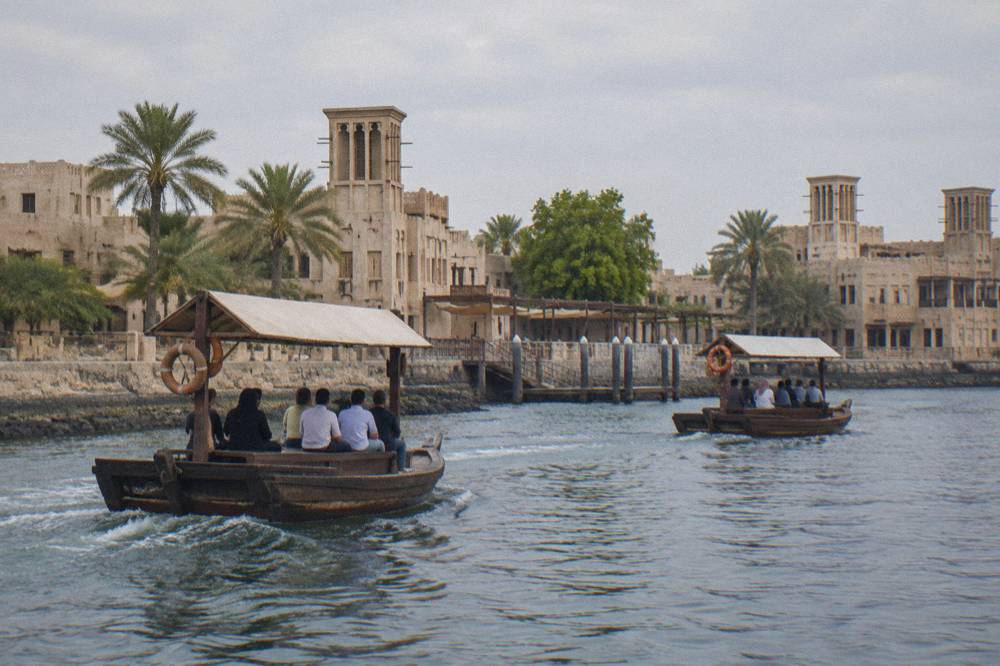Dubai Creek with traditional abra boats and the Al Shindagha district in the background