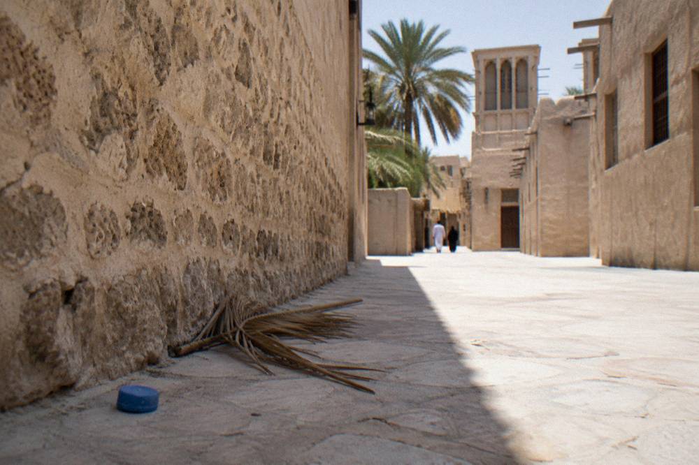 A narrow lane with old coral stone walls in the Al Fahidi Historical Neighbourhood