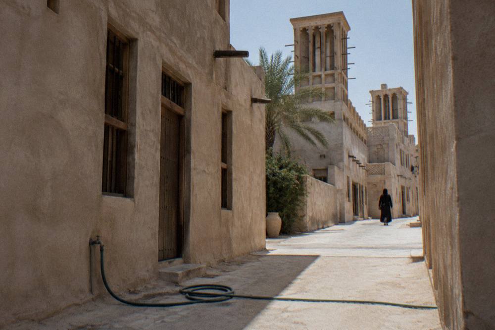 Narrow lane with wind tower houses in the Al Fahidi Historical Neighbourhood in old Dubai