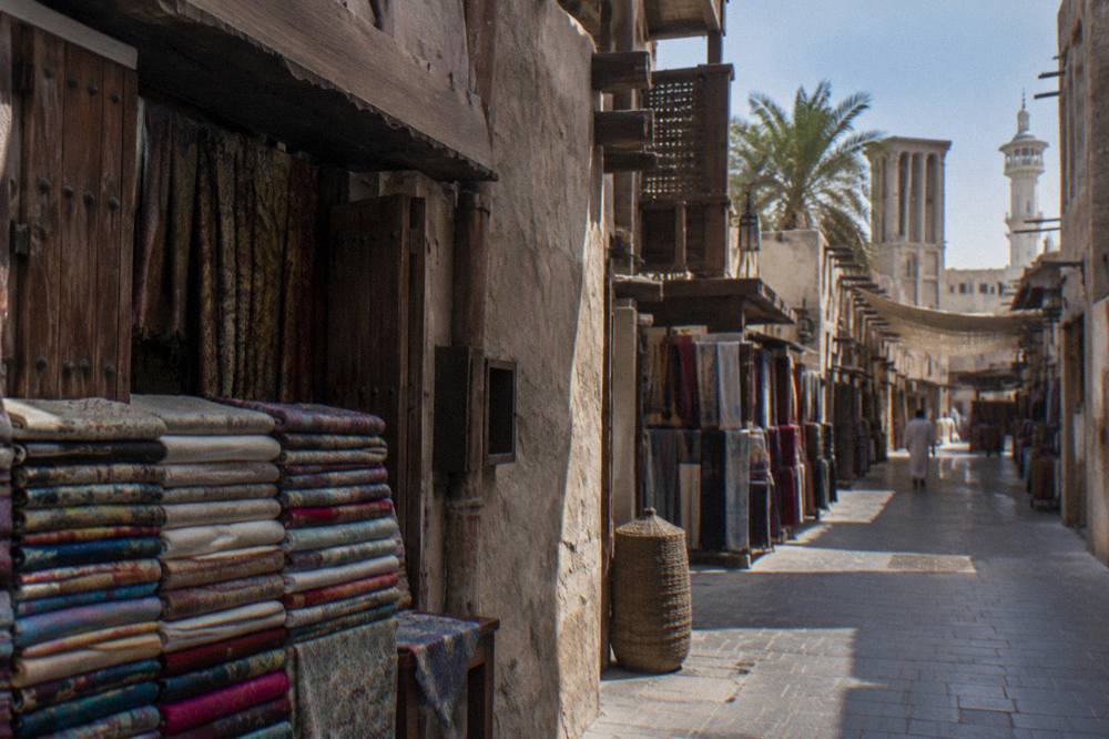 A Dubai street scene with heritage-style buildings in daylight