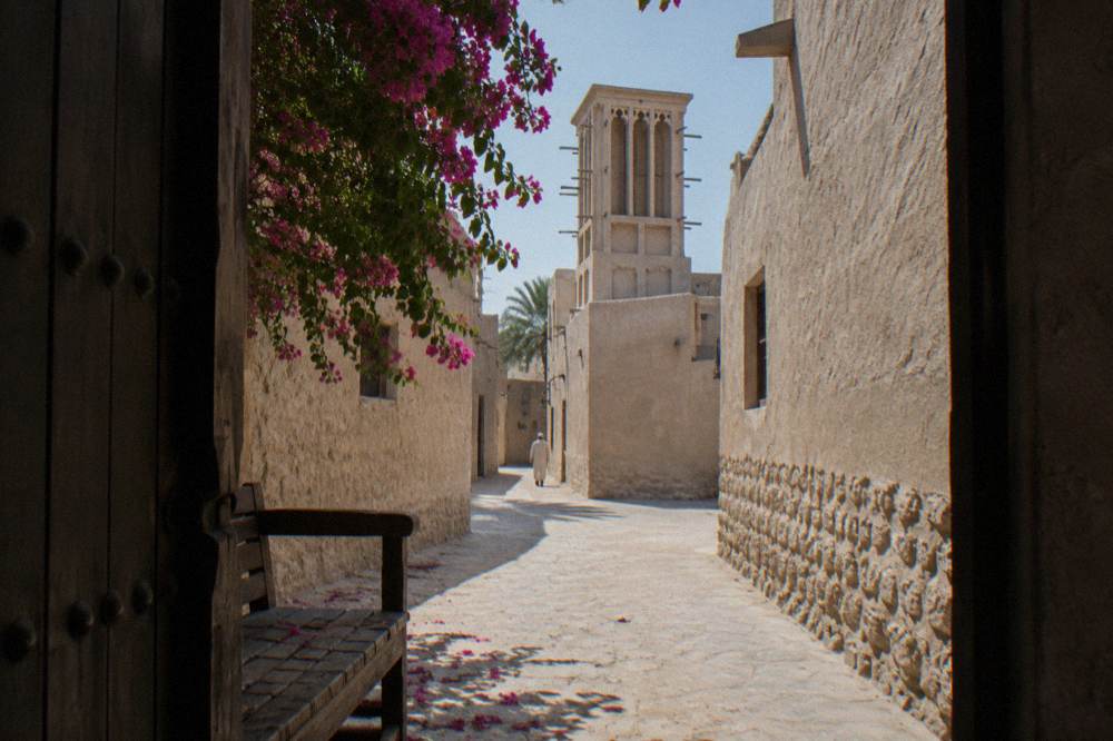 Narrow lane with wind-tower architecture in Al Fahidi Historical Neighbourhood