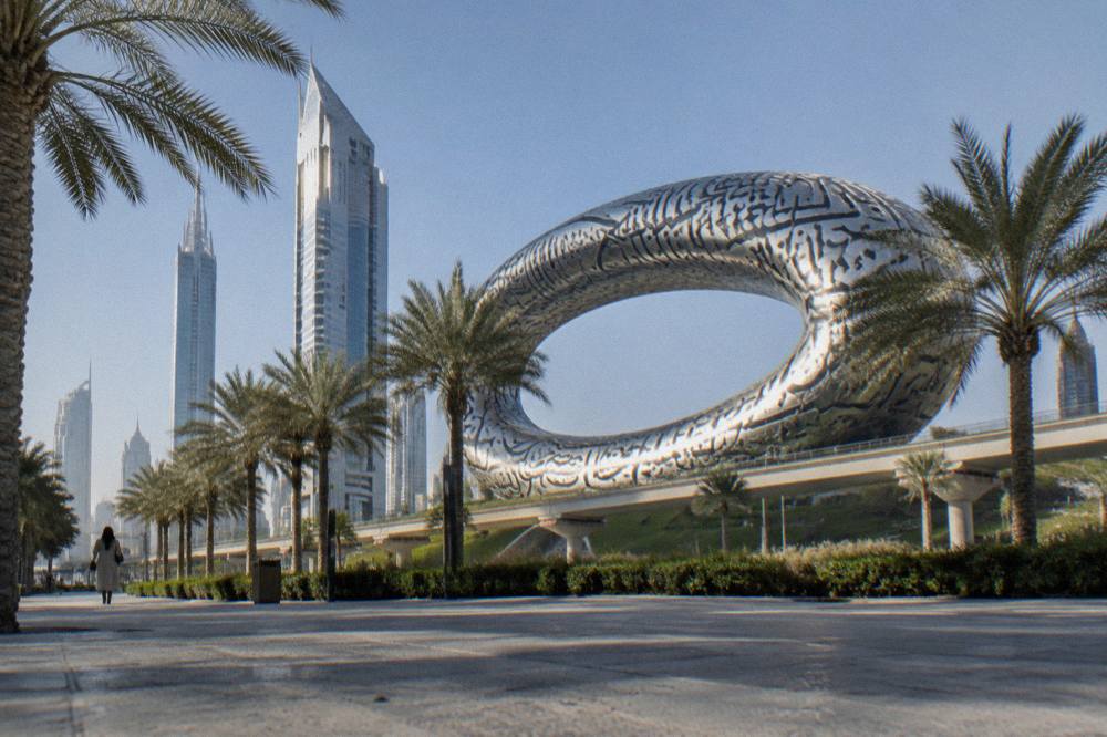 The ring-shaped exterior of the Museum of the Future building seen from street level
