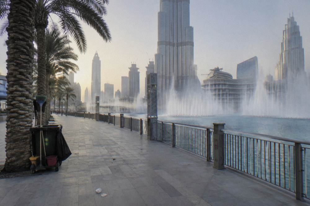 The Downtown Dubai waterfront promenade with the Burj Khalifa in the background