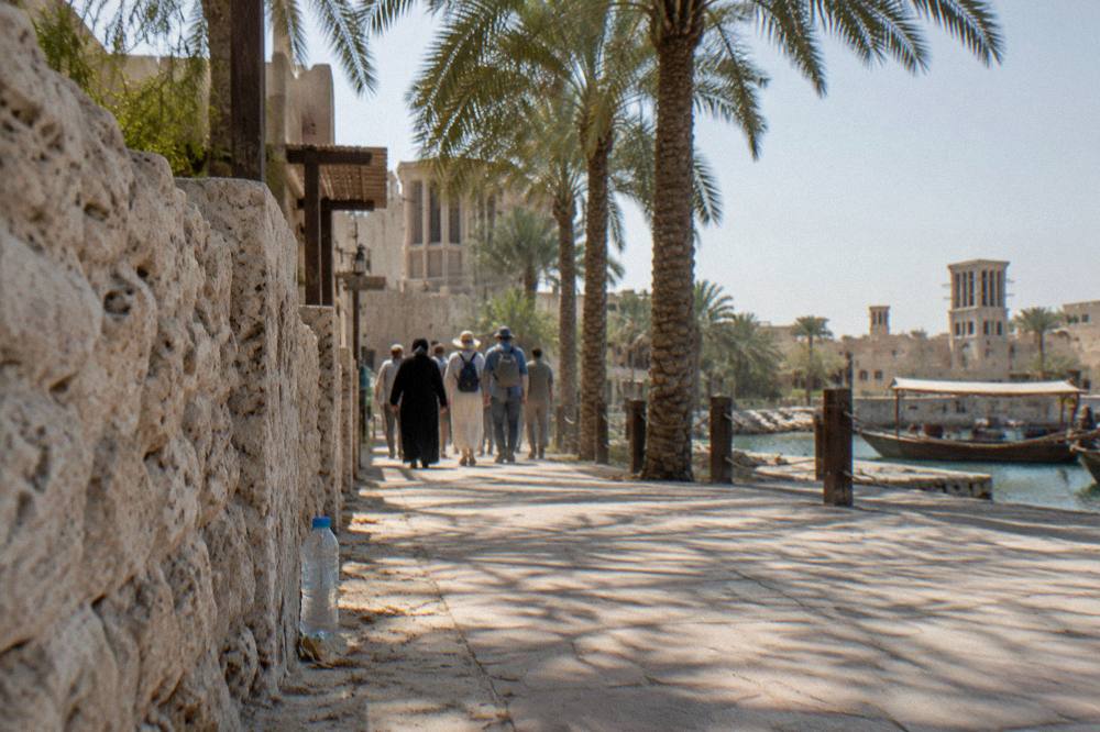 Guided walking tour passing through a heritage district in Old Dubai