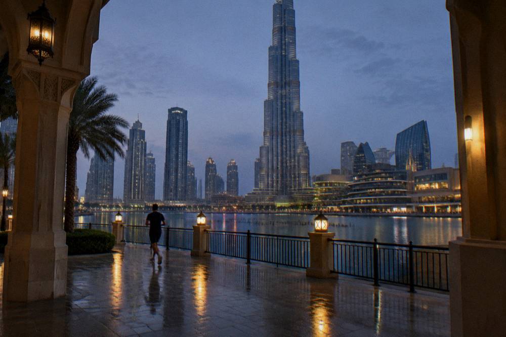 Waterfront promenade beside a lake outside a shopping mall in the evening