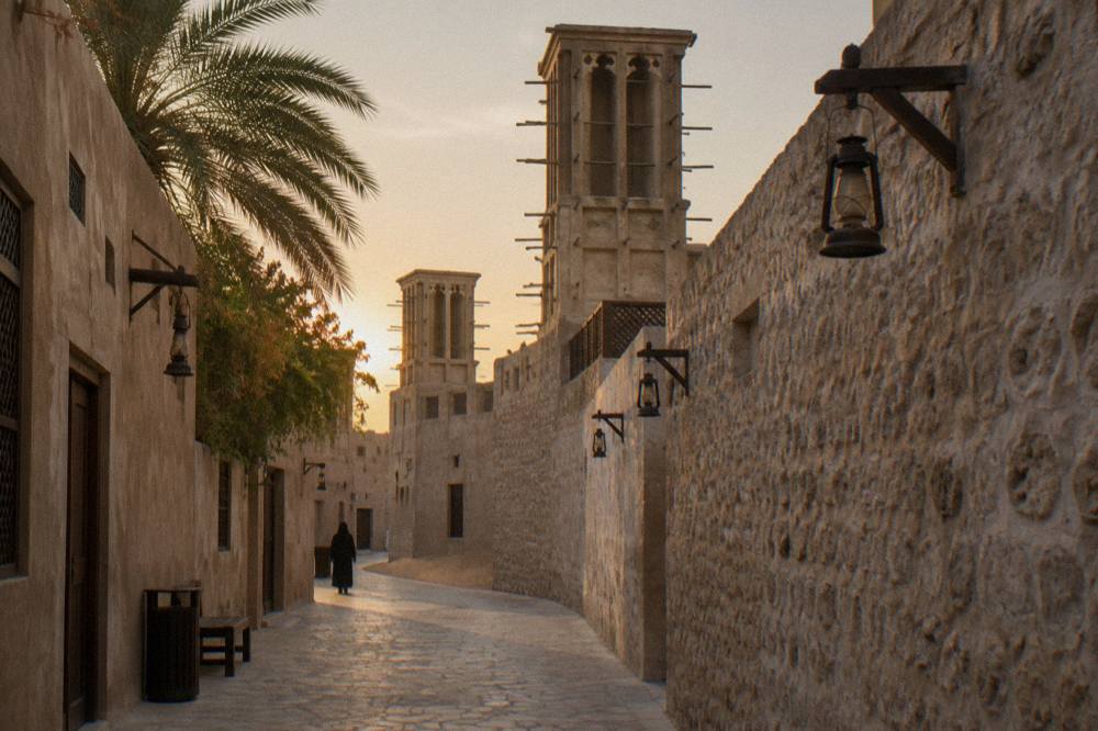 Narrow heritage lane with wind tower architecture in Old Dubai