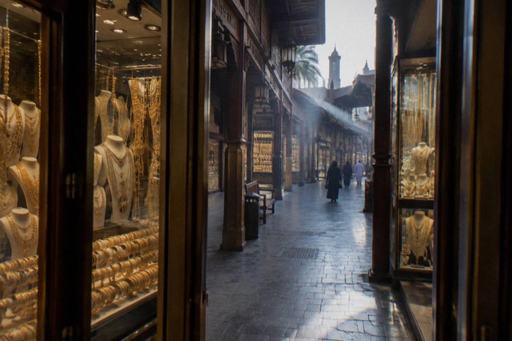 Gold shop windows along a lane in the Gold Souk